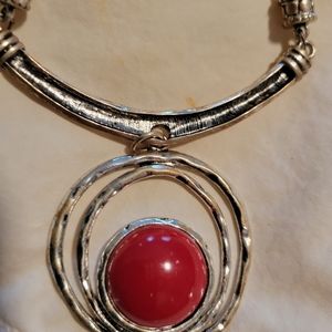 Silver necklace with red stone pendant